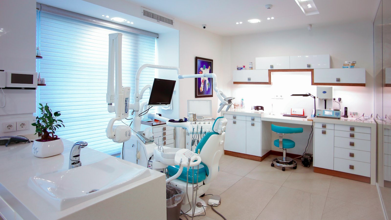 Modern dental practice treatment room with exam chair and equipment, representing outsourced HR for dental practices in New Jersey